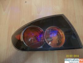 Продам Фонарь задний левый Мазда 3 2005г седан