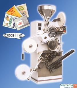 Автомат для упаковки пакетика чая с ярлыком.